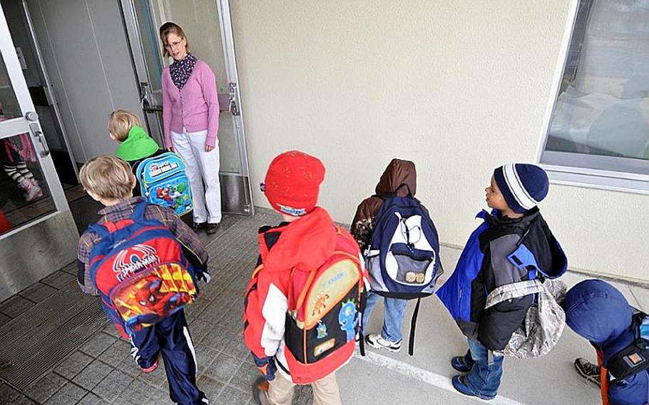 Ruth Sterry, a Sollars Elementary School teacher at Misawa Air Base, Japan, welcomes students back to school for the first time since the massive earthquake and deadly tsunami hit northeastern Japan on March 11.