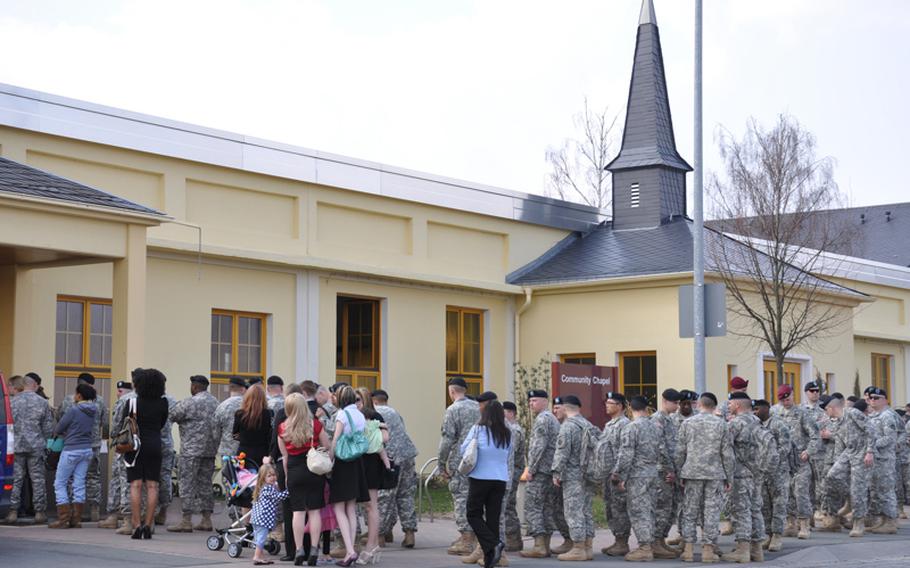Soldiers, friends and family members wait to enter the chapel fora memorial service honoring Staff Sgt. Joshua S. Gire, 28, of Chillicothe, Ohio, and Pfc. Michael C. Mahr, 26, of Homosassa, Fla., on Wednesday in Bamberg, Germany. Gire and Mahr were killed March 22 in Logar province, Afghanistan.