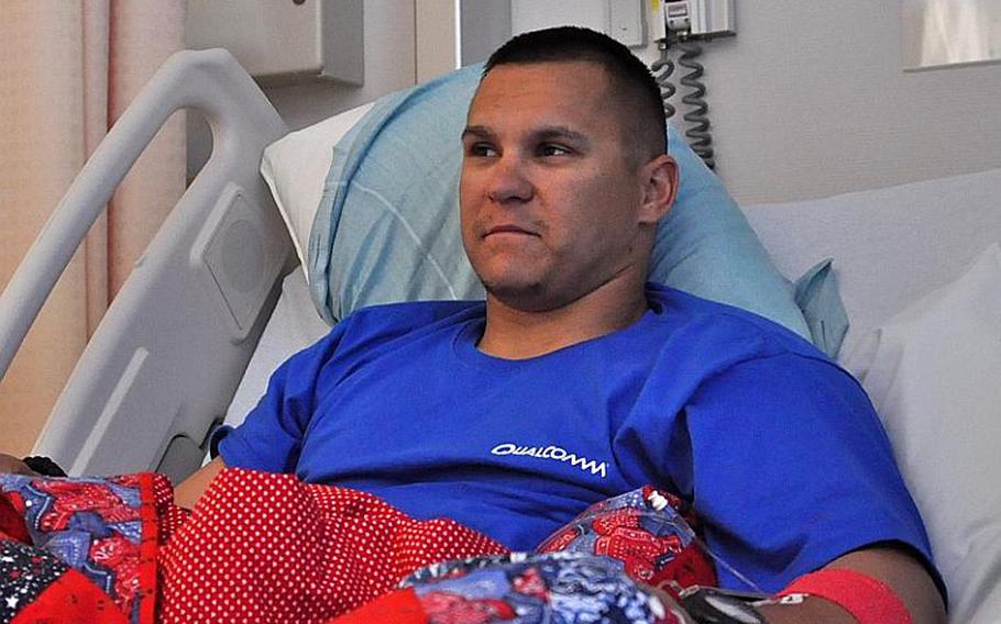 Cpl. Matt Macke, 26, learns of Osama bin Laden&#39;s death while recuperating Monday at Landstuhl Regional Medical Center. Macke, of the Iowa National Guard?&#39;s 1st Battalion, 168th Infantry Regiment, was injured in a roadside bomb blast in eastern Afghanistan&#39;?s Paktia province. Seth Robbins/Stars and Stripes