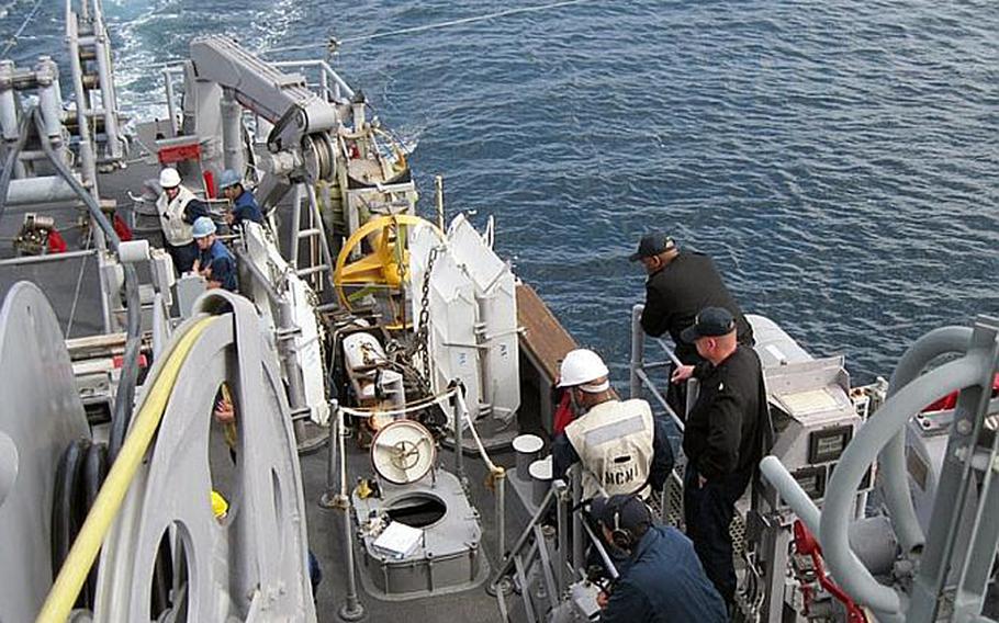 Minesweeping equipment is deployed off the fantail of the USS Avenger during March's Foal Eagle military exercise off the coast of South Korea. The Avenger is one of 14 U.S. Navy minesweeping vessels now in operation.