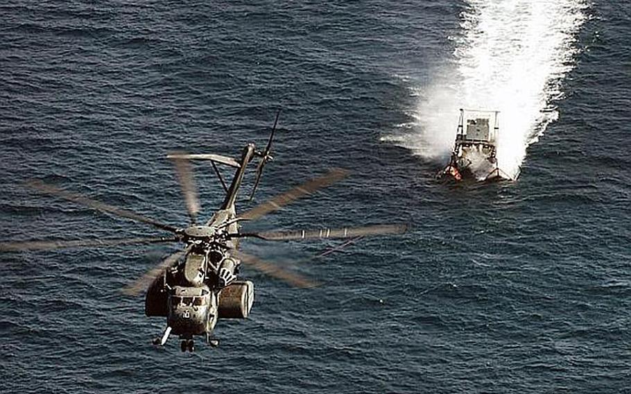An MH-53E Sea Dragon, from Helicopter Mine Countermeasure Squadron 15 performs mine countermeasure training using the MK-105 sled in the Persian Gulf in 2007.