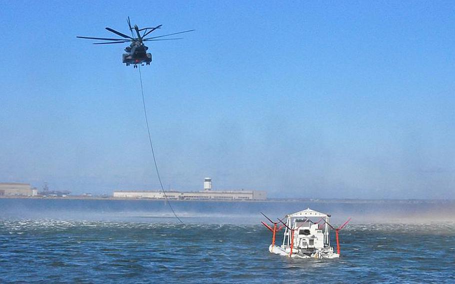 An MH-53E Sea Dragon helicopter assigned to Helicopter Mine Countermeasures Squadron 14 conducts practice MK-105 mine countermeasure operations in the Chesapeake Bay. HM-14 conducts these operations quarterly to ensure readiness to respond to worldwide airborne mine countermeasures operations.