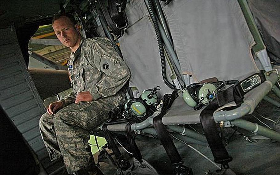 Staff Sgt. Wesley Shoemaker, 33, of Camarillo, Calif., sits in the passenger area of a Black Hawk helicopter at Camp Zama on Thursday. Shoemaker is a U.S. Army Aviation Detachment Japan crew chief. 
