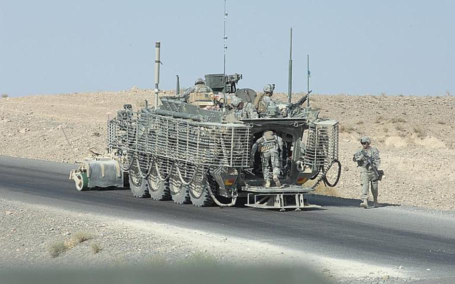 2nd Stryker Cavalry Regiment soldiers mount Stryker armored personnel carrier during a patrol in Kandahar province, Afghanistan last summer.