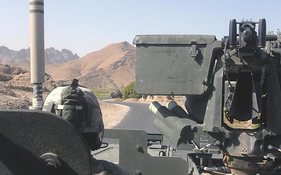 A 2nd Stryker Cavalry Regiment Stryker rolls along Route Bear, Afghanistan