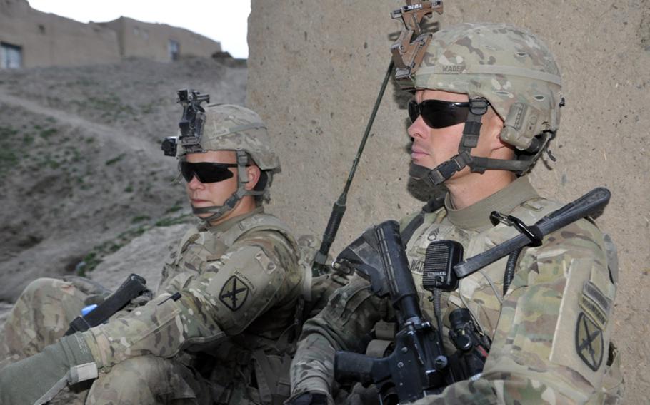 Sgt. Donald Wade, right, and Pfc. Joseph Tichacek of Company D of the 2nd Battalion, 30th Infantry Regiment of the 10th Mountain Division, catch a moment&#39;s rest during a patrol operation in the Kharwar District of Logar province last week.