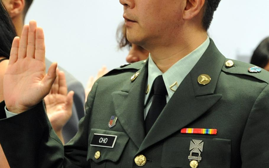 Private First Class Joon Cho, from South Korea, takes the oath of allegiance to become an American citizen at a naturalization ceremony in Frankfurt, on Wednesday. 