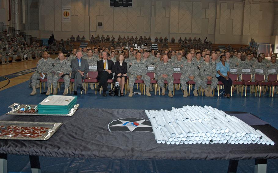 Diplomas and certificates sit on a table prior to being distributed at a Warrior University Recognition Event Thursday at Camp Casey in South Korea. More than 200 members of the 2nd Infantry Division were honored for taking at least five college classes -- and maintaining at least a 3.0 average -- since the Warrior University program was started 18 months ago. The program allows soldiers off work two hours early two days a week if they attend college classes.