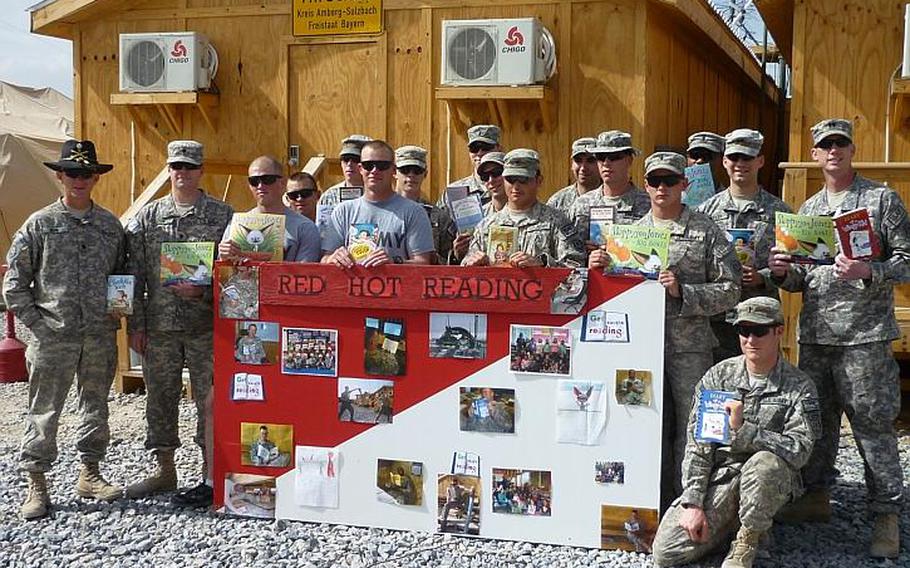 Soldiers of the Vilseck-based 2nd Stryker Cavalry Regiment pose with some of the books they read while in Afghanistan in partnership with students at the Vilseck Elementary School during Red Hot Reader Month in March.
Courtesy of Vilseck Elementary School