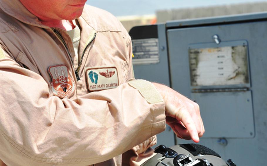 Tech. Sgt. Heath Culbertson, of the 83rd Expeditionary Rescue Squadron, shows where a bullet entered his helmet during a mission to recover the pilots of a downed Army helicopter on April 23 in Afghanistan. Culbertson was uninjured.