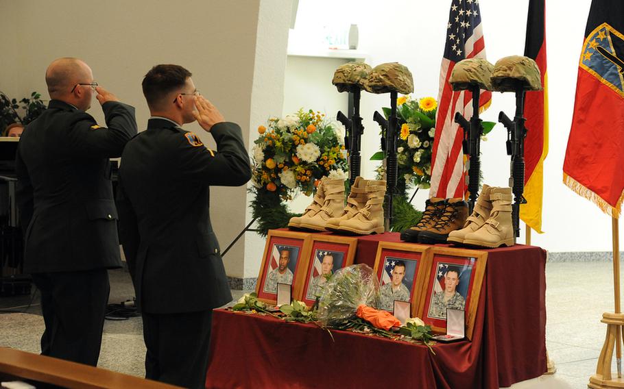 Soldiers give a final salute to Sgt. 1st Class Alvin Boatwright, Staff Sgt. Edward Dixon, Staff Sgt. Alan Snyder and Spc. Tyler Kreinz, following a memorial ceremony Wednesday in Baumholder, Germany. The four 170th Brigade Combat Team soldiers were killed in Afghanistan when their vehicle overturned on June 18.
