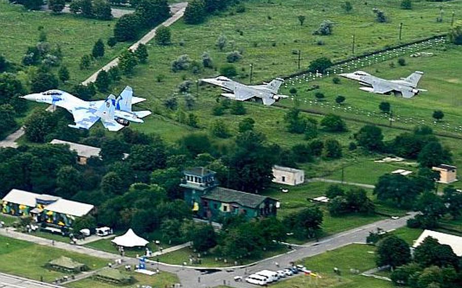 Air National Guard F-16Cs fly in formation with a Ukrainian SU-27 over Mirgorod Air Base, Ukraine during SAFE SKIES 2011 on Friday. U.S. pilots are working alongside their Ukrainian and Polish counterparts in preparation for the Euro Cup soccer competition next summer. The host countries are responsible for ensuring the air space is kept safe.
Courtesy U.S. Air Force Tech. Sgt. Charles Vaughn