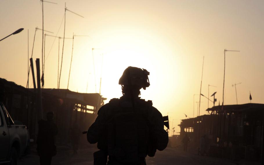 Marine Lance Cpl. Daniel Triebell, a 21-year-old squad leader from Melbourne, Fla., patrols through Lakari Bazaar on July 22. Triebell is a member of Company A, 1st Battalion, 3rd Marine Regiment.