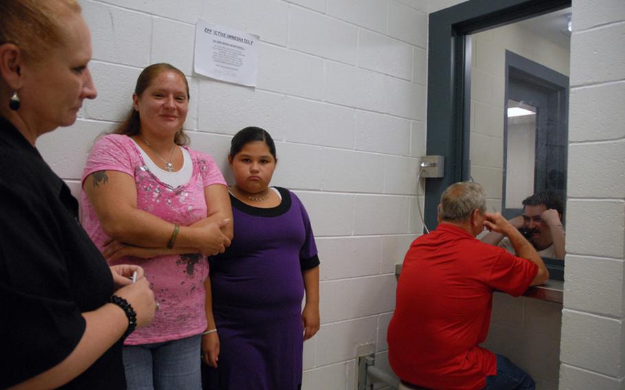 Former Army Sgt. Robert Quinones talks to his mom, Janet Gladwell, during weekly visiting hours at a county jail in Statesboro, Ga. Quinones is being held for going into the hospital on nearby Fort Stewart and holding three soldiers hostage in September 2010.
