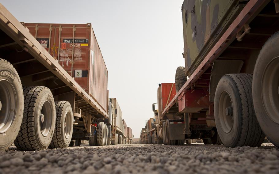 Dozens of armored cargo trucks prepare to unload and load cargo at the largest U.S. Army Central Shipping and Receiving Point yard in Iraq at Sather Air Base outside Baghdad on August 18. More than 1,200 units of goods are currently at the yard while 300-500 units arrive and are shipped out each day. These trucks will be loaded with goods brought to Sather from bases that are drawing down and closing and driven to Contingency Operating Base Adder, an enduring U.S. base in Tallil, Iraq.