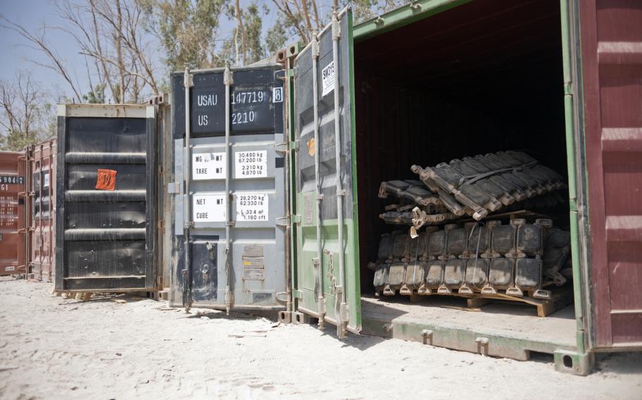 Tank tracks, weapons, tires and other used materials are separated into containers at Sather Air Base outside Baghdad, Iraq, that will be transferred to a different unit in need of the item, be shipped back to the United States, given to Iraq or be disposed of as part of the drawdown of U.S. forces in Iraq.