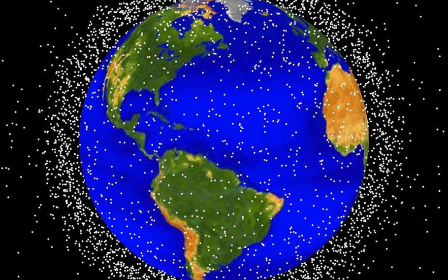 The Air Force tracks thousands of objects ? satellites and space junk ? that fill the skies above earth, as shown in this computer-generated image.