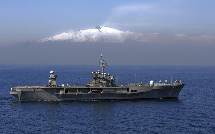 The U.S. 6th Fleet flagship Mount Whitney, seen here sailing past Mount Etna, is one of only two flagships in today?s Navy. Originally slated to be decommissioned in the next few years after four decades of services, the Navy will extend its service life to 2039.