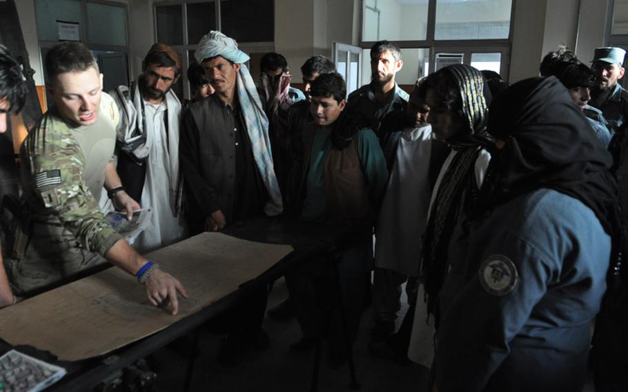 At a police station in Kandahar City, 1st Lt. Lee Robinson, of Apache Troop, 1-10 Cavalry, planned a ''soft-knock'' raid in mid-September with members of the Afghan National Police.