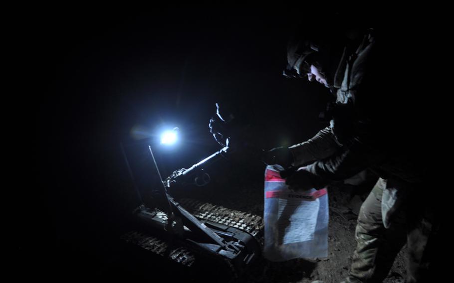 An EOD soldier retrieved an unexploded mortar round from a robot in Kandahar City in mid-September. The mortar was found by Afghan police following a tip from a citizen. ''We're seeing an increase in tips coming in from the population,'' said Lt. Col. Doug Winton, deputy commander of the 2nd Brigade of the 4th Infantry Division. ''There is a growing trust between the people and the police.''