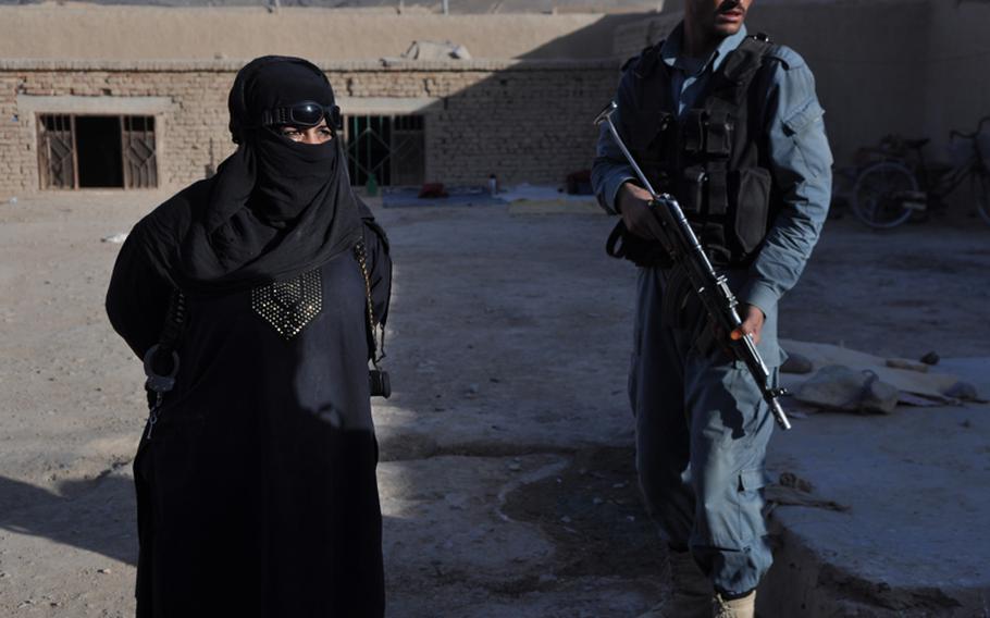 Afghan police officers during the search of a compound in northwestern Kandahar City this September.