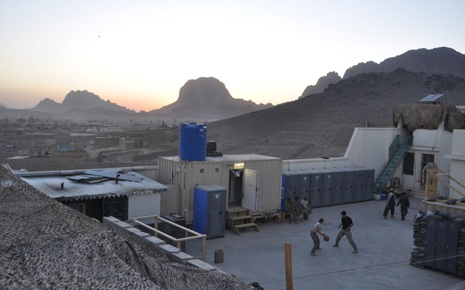 First Lt. Anna Kowalk, of 3rd Platoon, 561st Military Police Company, played basketball with an Afghan interpreter at a police station on the northwestern edge of Kandahar City.