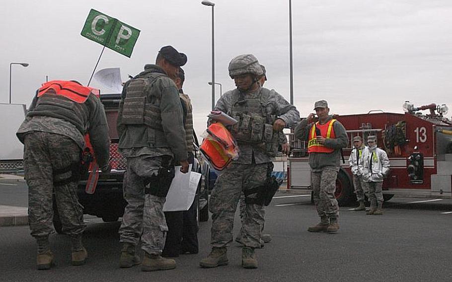 Airmen from the 374th Airlift Wing at Yokota Air Base set up a temporary command post near a field where a possible unexploded bomb was unearthed about 1 p.m. Dec. 6, 2011. Nearby buildings were evacuated and roads were closed. An explosive ordnance disposal team from nearby Yokosuka Naval Base was called to the scene to assist, according to Yokota officials.