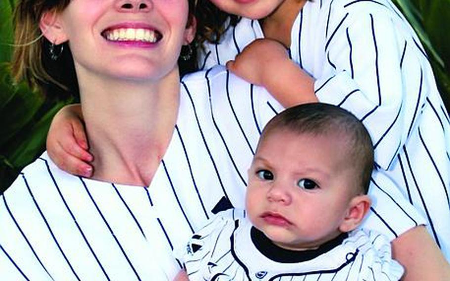 The airman husband of Kelli Abad said Thursday she may have committed suicide after leaving a cryptic note in her abandoned vehicle. Here, Abad poses with her two children for a family photo in 2010.