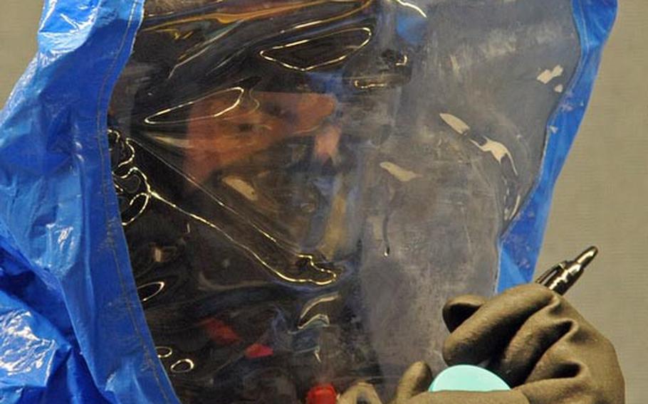 Sgt. David Larkin labels a specimen gathered in a "contaminated zone" during a training exercise in Kaiserslautern on Dec. 6. Larkin is with the 773rd Civil Support Team, the only active Army Reserve Civil Support Team stationed outside of the continental U.S. It is capable of deploying in support of U.S. Army Europe in response to a chemical, biological, radiological or nuclear incident.
