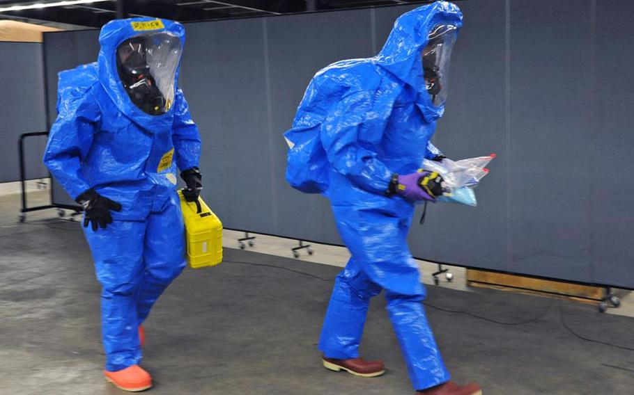 Staff Sgt. Tim Butler, left, and Sgt. David Larkin, both of the 773rd Civil Support Team head into a mock contaminated zone during a training exercise in Kaiserslautern on Dec. 6. The 773rd CST is the only active Army Reserve Civil Support Team stationed outside of the continental U.S., and is capable of deploying in support of U.S. Army Europe in response to a chemical, biological, radiological or nuclear incident.
