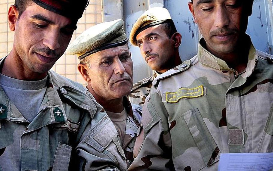 Iraqi Army soldiers take inventory of munitions on Oct. 10 at Besmaya, Iraq. Airmen advised the soldiers about ammunition logistics during a recent 26-day course.