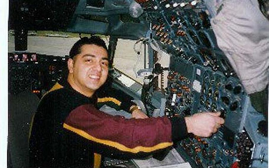 In this undated photo, Staff Sgt. Ahmed Altaie smiles as he sits behin the controls of a plane. The amateur pilot had a passion for flying and was an airplane mechanic prior to the Sept. 11 attacks, family and friends said.