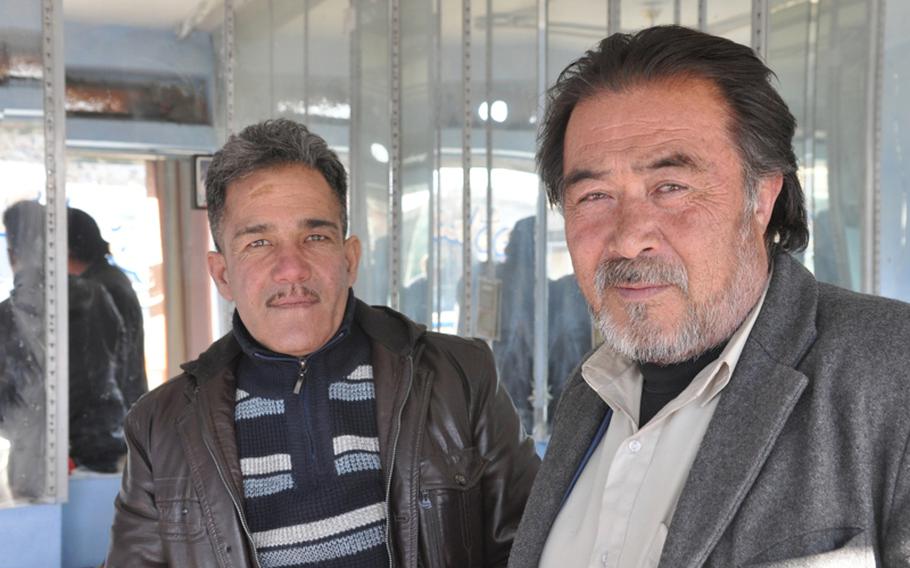 Sayed Hashim, left, and Abdul Raziq, who run a house rental business in Kabul, knew how the world would react to the violence that erupted over the recent burning of Qurans at a U.S. base. ''People in the West see the images of demonstrations and they think all of us are the same,'' Raziq said.