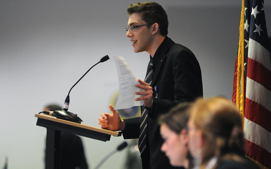 Heidelberg senior Nathan Schiele, portraying Senate Republican Leader Mitch McConnell, R-Ky, debates a bill on the senate floor at the DODDS-Europe Model U.S. Senate in Raunheim, Germany, Thursday. More than 100 students from all over Europe took part in the five-day simulation of the legislative body.