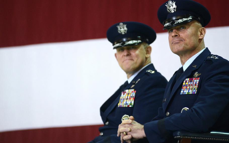 Lt. Gen. Craig A. Franklin, assuming Commander, Third Air Force, right, and Lt. Gen. Frank Gorenc, Commander, Third Air Force, look to their wives as Gen. Mark A. Welsh III, Commander, U.S. Air Forces in Europe, gives the opening remarks and presides over the Third Air Force change of command ceremony Friday morning at Ramstein Air Base, Germany.