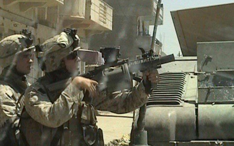 Former Marine Shaun Valdivia, holding weapon, conducts operations in Ramadi, Iraq, in 2006. Valdivia now works at the Jacksonville, Fla.-based Veterans Farm, which employs injured veterans. The farm is a finalist in Walmart's "Get on the Shelf" contest.