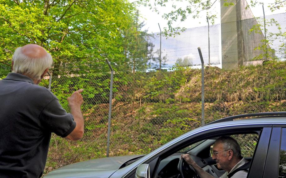 Ulrich Durst, left, and Eberhard Knobloch stop along a trail that runs by the Panzer firing range in Boeblingen, Germany, and leads to the Rauher Kapf neighborhood about 300 yards from the range. The trail is popular with bikers and joggers as well as families out for a stroll. Durst and Knobloch are retirees and residents of the neighborhood.