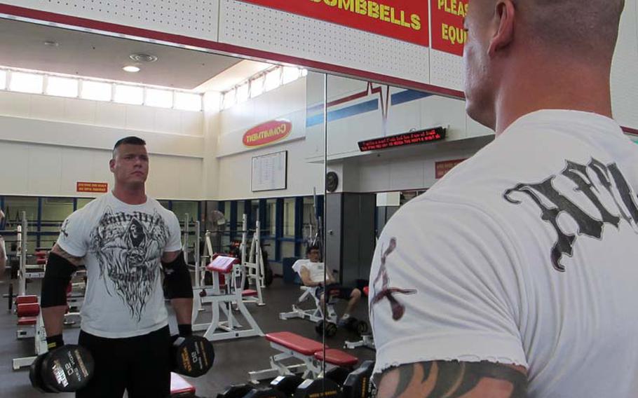 Sgt. Gaylon Summers, a Marine Aviation Logistics Squadron 12 ground safety manager stationed at Marine Corps Air Station Iwakuni, works out at IronWorks Gym on base in May. Summers will pursue his dream of being a professional wrestler when he begins training in New Japan Pro-Wrestling's dojo in August. He hopes his tireless work ethic and dedication to training can help him climb the ladder in professional wrestling.
