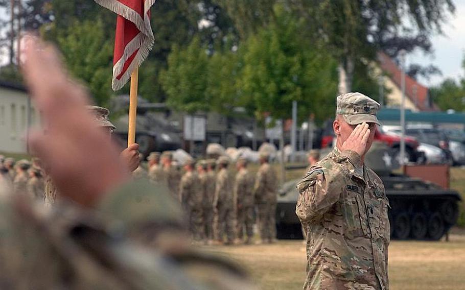 Lt. Col. Jayson C. Gilberti, commander of the 9th Engineer Battalion, salutes his commander, Col. Edward T. Bohnemann, during a review at a Thursday uncasing ceremony for the 172nd Separate Infantry Brigade in Grafenwöhr, Germany. The brigade returned in July from an 11-month deployment to eastern Afghanistan.