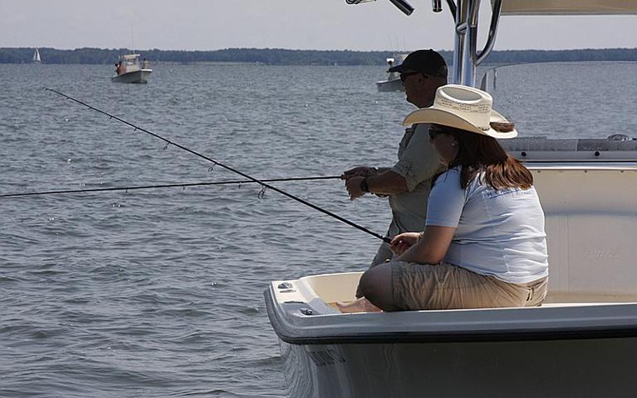 Chris Frost, an Air Force veteran, and his wife, Cathy, an Army veteran, fish during Project Healing Waters&#39; Stars and Stripers tournament last month in Chester, Md.
