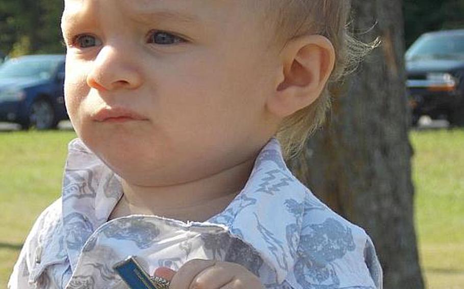 Spc. Jacob Andrews&#39; son, Jake, wears a combat infantryman badge his father earned in Afghanistan.