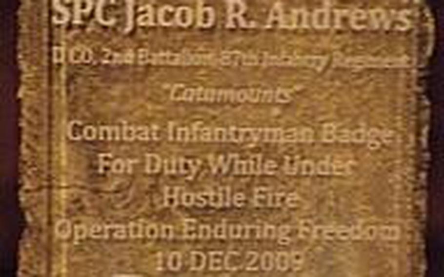 Spc. Jacob Andrews&#39; family received this plaque from his former unit at a ceremony to posthumously present him with the combat infantryman badge he earned in Afghanistan in 2009, but didn&#39;t receive.