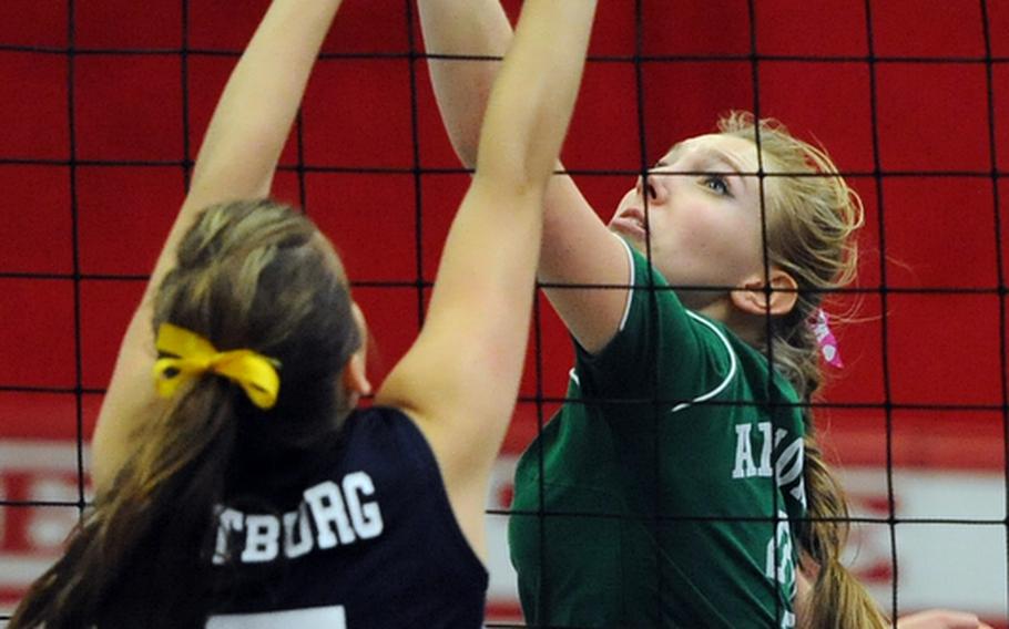 Bitburg's Lydia Horn, left, and AFNORTH's Abby Kinnear fight at the net in their match at Kaiserslautern, Saturday. Bitburg won 25-21, 25-19, 24-26, 26-24.