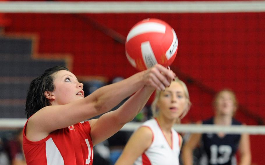 Kaiserslautern's Jordan Albers, left, returns a Bitburg shot as teammate Tonje Lunde watches. Kaiserslautern beat Bitburg 25-13, 25-18, 25-23.