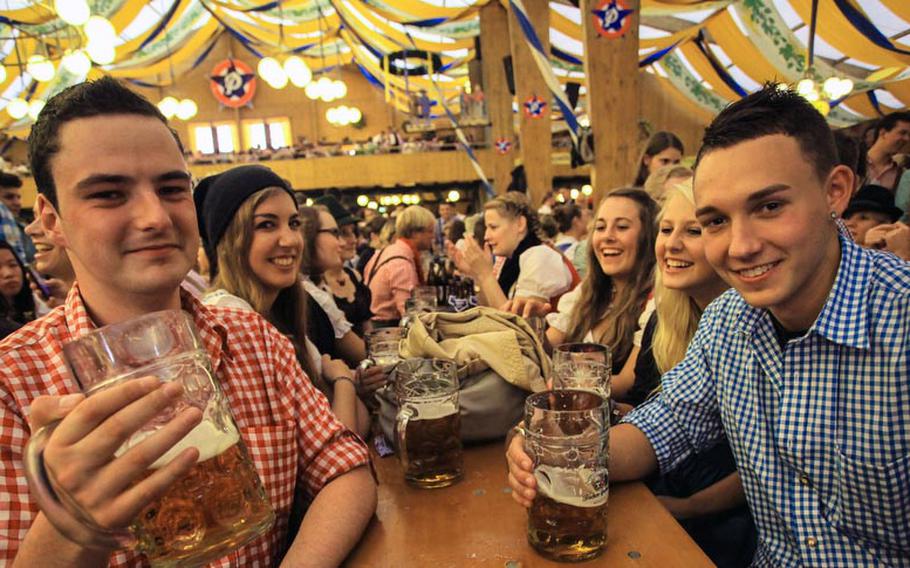 Timo Rumpelt, left, a 20-year-old from Munich, has attended 16 Oktoberfests. "It's just every year the same - it's just amazing," he said.