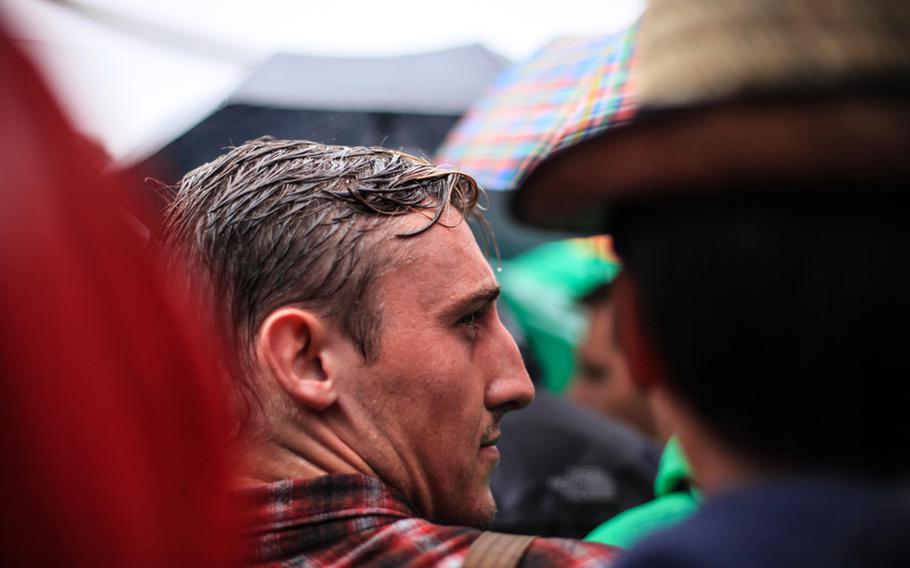 A rain-drenched partygoer wait&#39;s outside Oktoberfest&#39;s Schottenhamel tent - where the festivities begin - before being told the tent was already full. By then, he and many had waited nearly two hours in the rain.