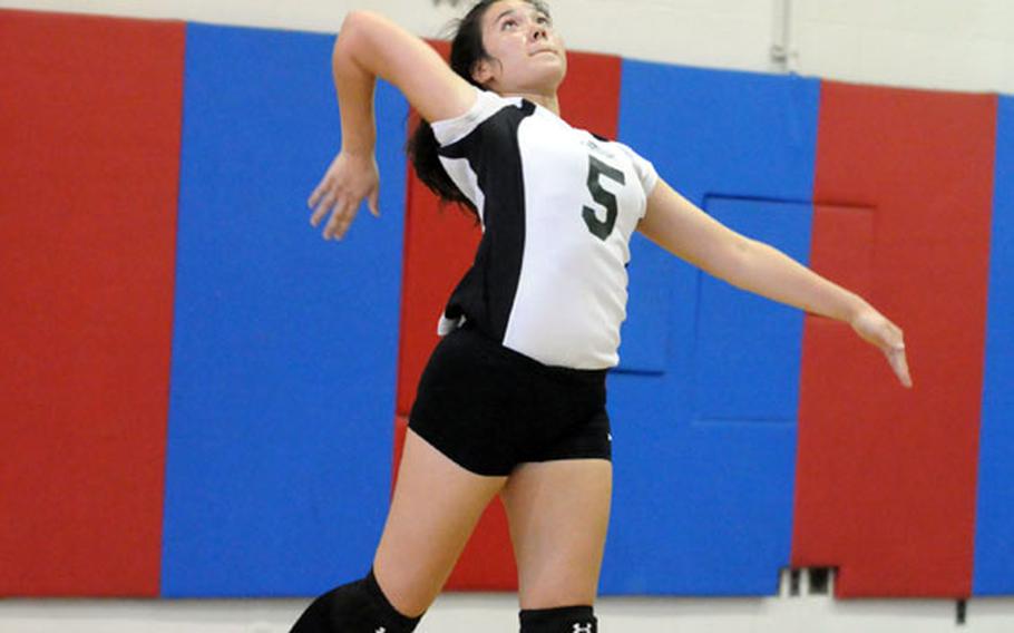 Sept. 26, 2012 Daegu High Warriors junior middle blocker Kaitlyn Nott jump serves against Taejon Christian International Dragons during Wednesday&#39;s Korean-American Interscholastic Activities Conference girls Five-Cities Division girls volleyball match at Kelly Field House, Camp Walker, South Korea. The Warriors won 25-15, 25-23, 26-28, 25-9.