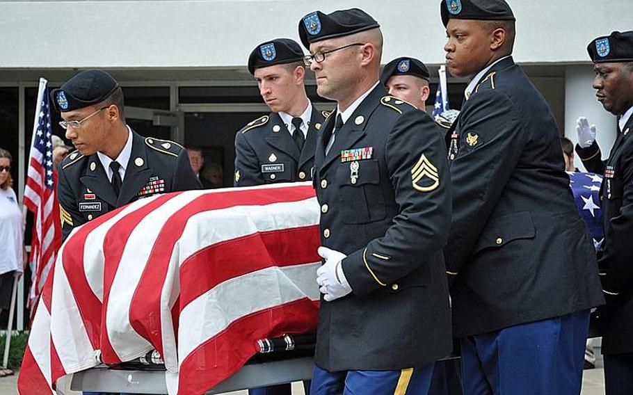 Army Honor Guard soldiers carry the casket of Pfc. Jon Townsend after his funeral Sept. 28 in Claremore, OK. Townsend was killed earlier in the month in an insider attack in Afghanistan.