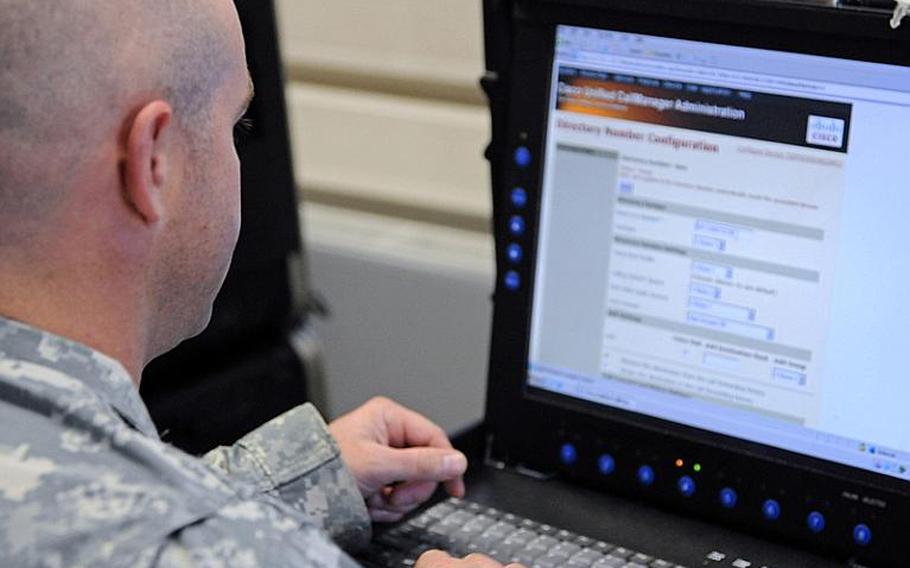U.S. Army Sgt. Ryan Lalk, assigned to the 72nd Expeditionary Signal Battalion, attempts to set up a connection with the call manager during Cyber Endeavor, an exercise within Combined Endeavor 11, in Grafenwoehr, Germany, Sept. 14, 2011. Combined Endeavor is an annual command, control, communications, and computer systems exercise designed to prepare international forces for multinational operations in the European theater.