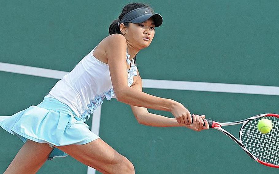 Natalie Burke of Zama American Trojans lunges for a backhand against Yokota Panthers&#39; Anju Yamanaka during Tuesday&#39;s girls quarterfinal singles match in the Far East High School Tennis Tournament at Risner Tennis Complex, Kadena Air Base, Okinawa. Burke won 8-2.